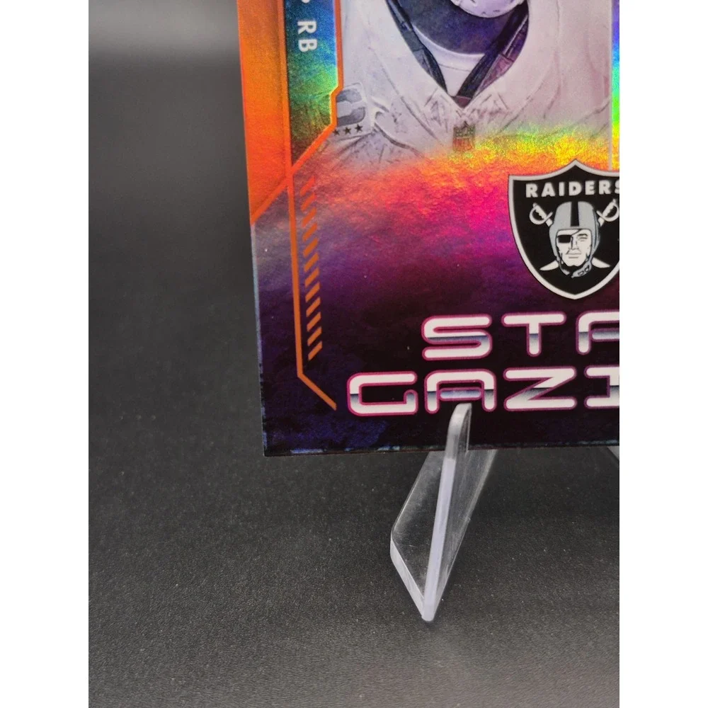 2023 Panini Absolute Josh Jacobs #SG-11 Star Gazing Orange /75 Packers Raiders